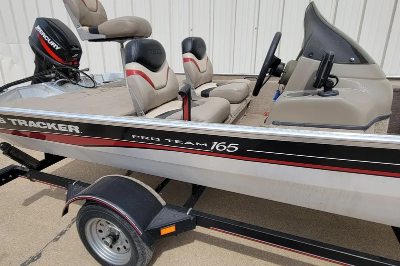 Slide: The Image of 2003 Tracker Pro Team 165 fishing boat with Mercury outboard motor and trailer. - 14