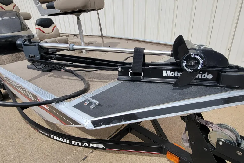 Slide: The Image of 2003 Tracker Pro Team 165 boat with a MotorGuide trolling motor on a Trailstar trailer. - 15
