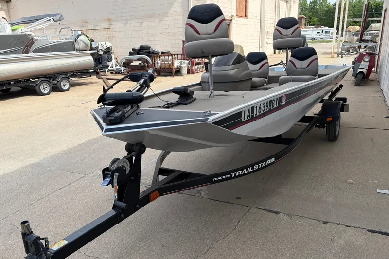 Slide: The Image of 2003 Tracker Pro Team 165 boat on trailer, parked outdoors. - 2