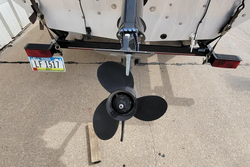 Slide: The Image of 2003 Tracker Pro Team 165 boat propeller and trailer with Iowa license plate. - 29