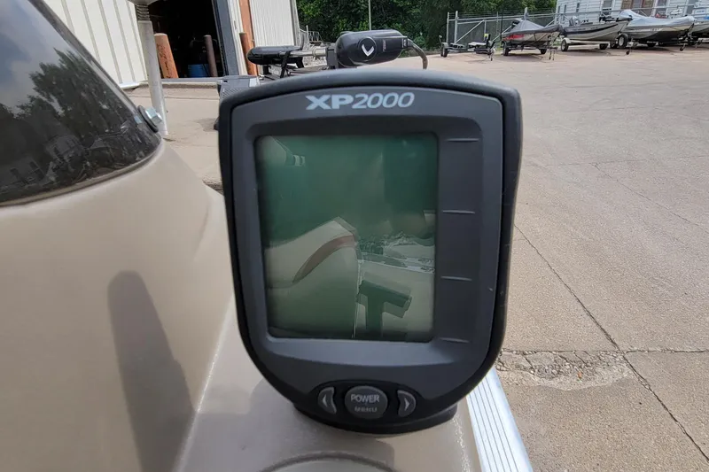 Slide: The Image of Fishfinder XP2000 on 2003 Tracker Pro Team 165 boat, outdoor setting. - 31
