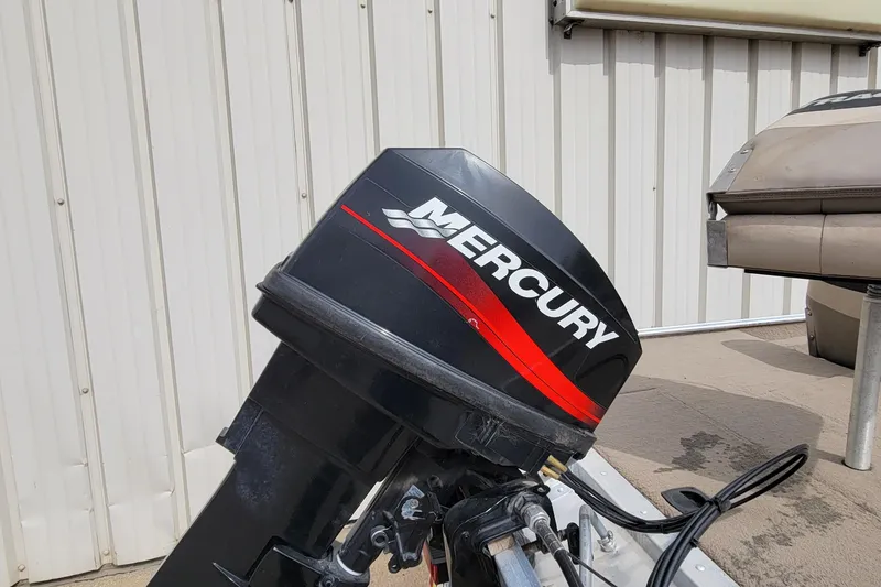 Slide: The Image of Mercury outboard motor on a 2003 Tracker Pro Team 165 boat. - 8