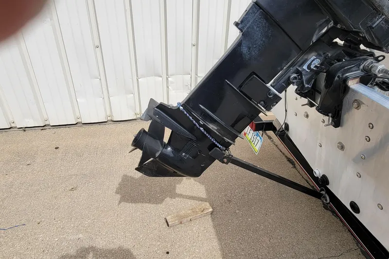 Slide: The Image of 2003 Tracker Pro Team 165 boat motor and propeller on concrete surface. - 9