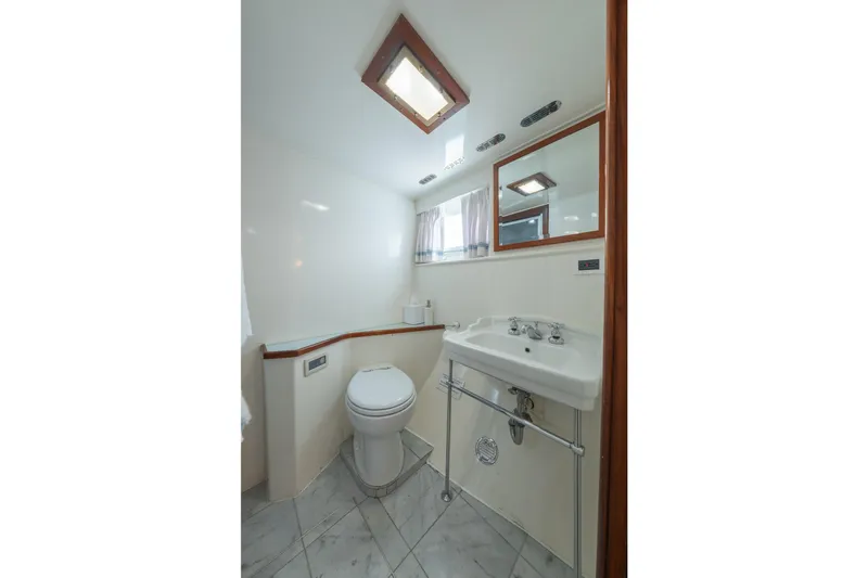 Slide: The Image of Bathroom interior of 1939 Mathis Trumpy Fantail Houseboat with sink and toilet. - 11
