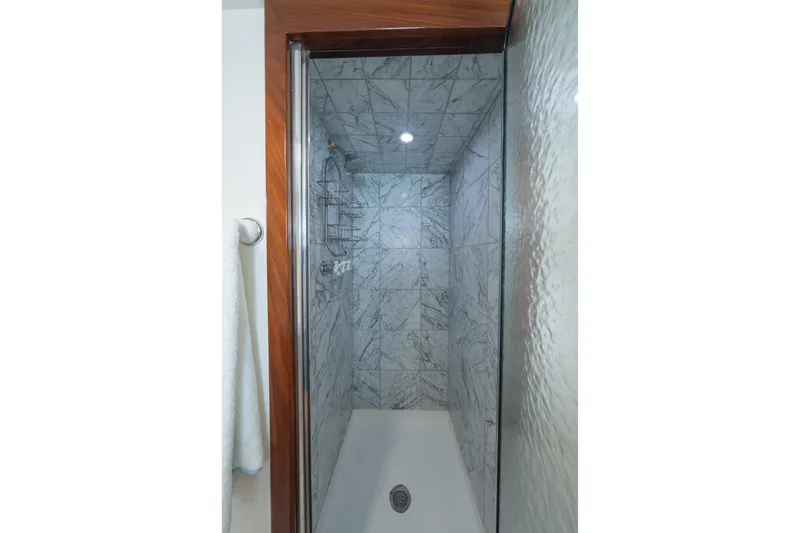Slide: The Image of Marble-tiled shower in 1939 Mathis Trumpy Fantail Houseboat. - 15