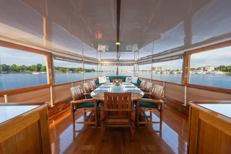 Slide: The Image of Elegant 1939 Mathis Trumpy Fantail Houseboat dining area with panoramic water views. - 29