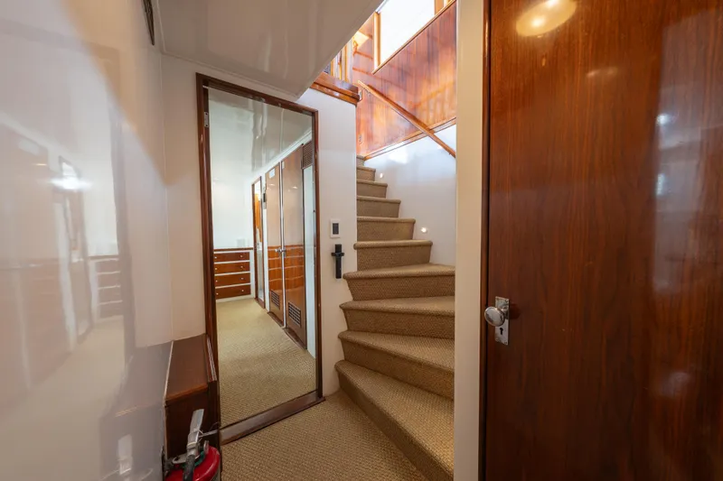 Slide: The Image of Interior of 1939 Mathis Trumpy Fantail Houseboat with wooden stairs and hallway. - 6