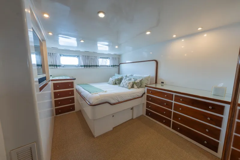 Slide: The Image of Luxurious bedroom interior of 1939 Mathis Trumpy Fantail Houseboat with elegant wood accents. - 7