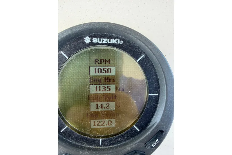 Slide: The Image of Suzuki gauge displaying RPM, engine hours, and other metrics on Parker 23SE Center Console boat. - 18