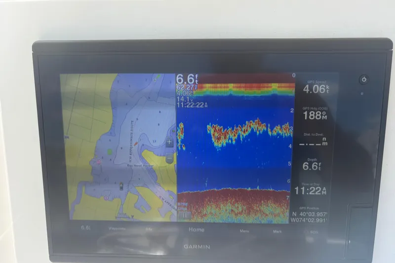 Slide: The Image of Garmin marine GPS display on 2006 Parker 23SE Center Console boat, showing navigation and sonar data. - 19