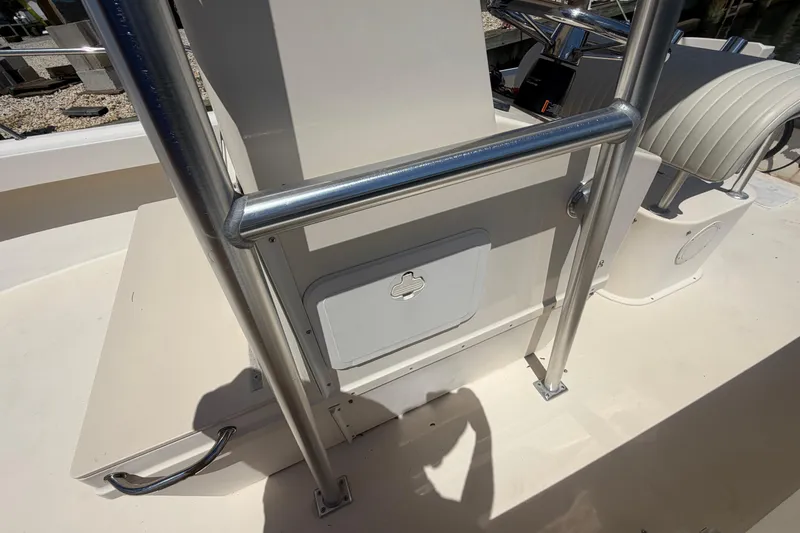 Slide: The Image of 2006 Parker 23SE Center Console boat interior with stainless steel railing and storage compartment. - 22