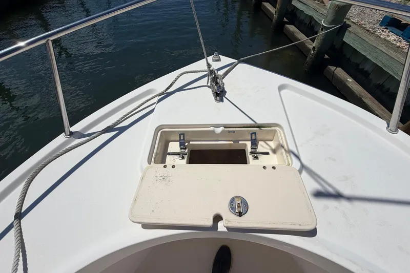 Slide: The Image of 2006 Parker 23SE Center Console boat deck with open storage compartment. - 30