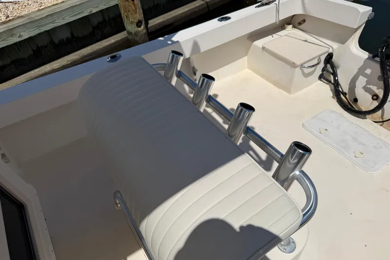 Slide: The Image of 2006 Parker 23SE Center Console boat interior with rod holders and seating. - 8