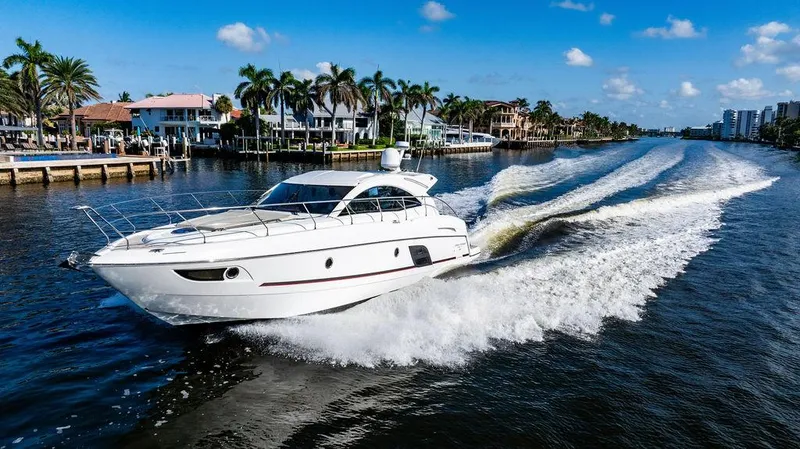 Slide: The Image of 2016 Beneteau GRAN TURISMO 49 yacht cruising on a sunny waterway. - 13