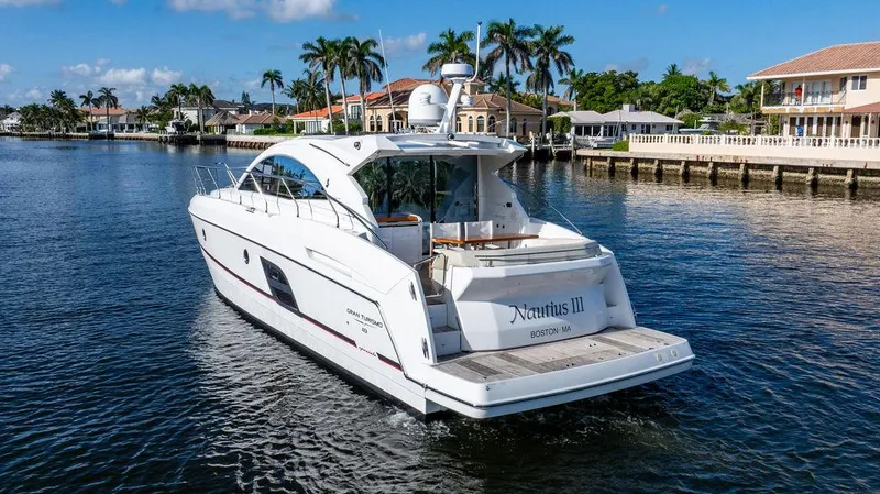 Slide: The Image of Beneteau Gran Turismo 49 yacht cruising in a scenic waterfront area, 2016 model. - 14