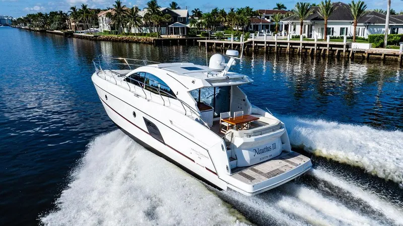 Slide: The Image of 2016 Beneteau GRAN TURISMO 49 yacht cruising on a scenic waterway. - 17