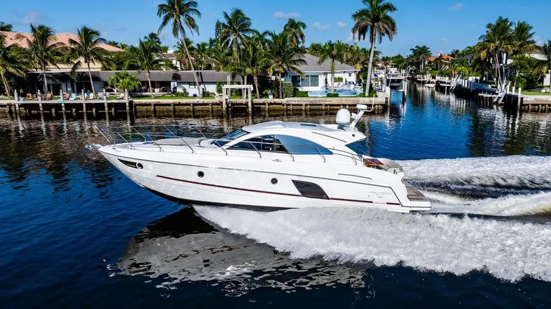 Slide: The Image of 2016 Beneteau Gran Turismo 49 yacht cruising on a sunny waterfront. - 5