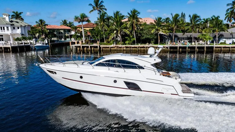 Slide: The Image of 2016 Beneteau Gran Turismo 49 yacht cruising on a scenic waterway. - 6