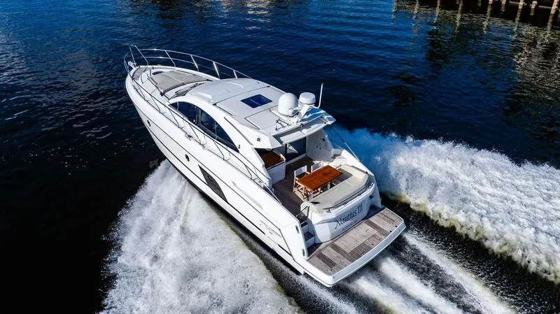 Slide: The Image of 2016 Beneteau GRAN TURISMO 49 yacht cruising on open water. - 7