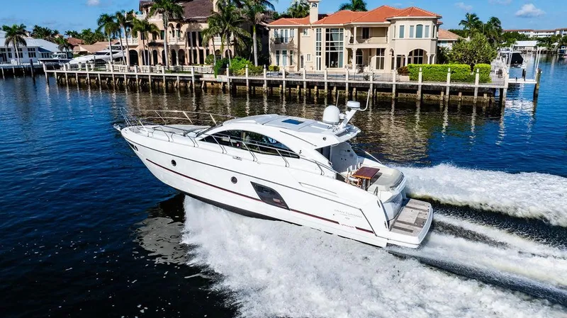 Slide: The Image of 2016 Beneteau GRAN TURISMO 49 yacht cruising on a sunny waterfront. - 8