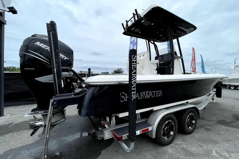 Slide: The Image of 2019 ShearWater 25 LTZ boat with Mercury Verado engine on trailer. - 2