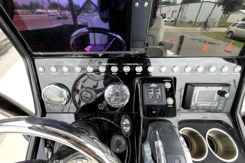 Slide: The Image of Dashboard of a 2019 ShearWater 25 LTZ boat with gauges and controls. - 20
