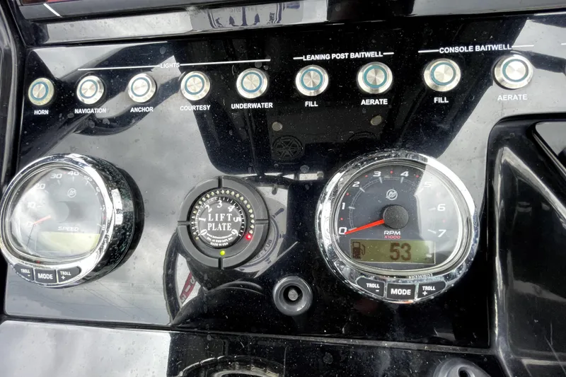 Slide: The Image of Dashboard of a 2019 ShearWater 25 LTZ boat with gauges and control buttons. - 23