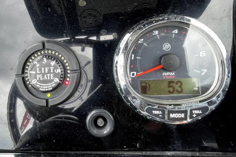 Slide: The Image of Dashboard of a 2019 ShearWater 25 LTZ boat with gauges and control buttons. - 24