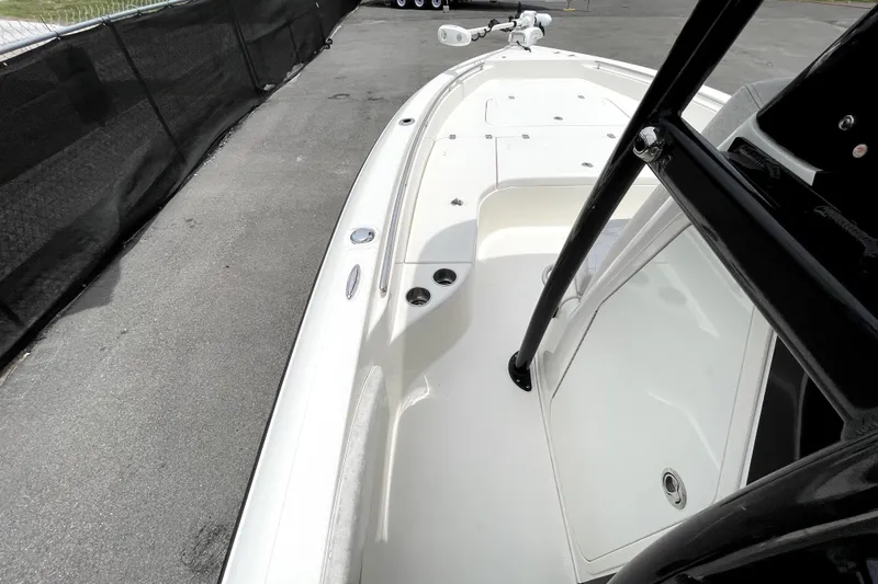 Slide: The Image of 2019 ShearWater 25 LTZ boat deck with sleek design and storage compartments. - 28