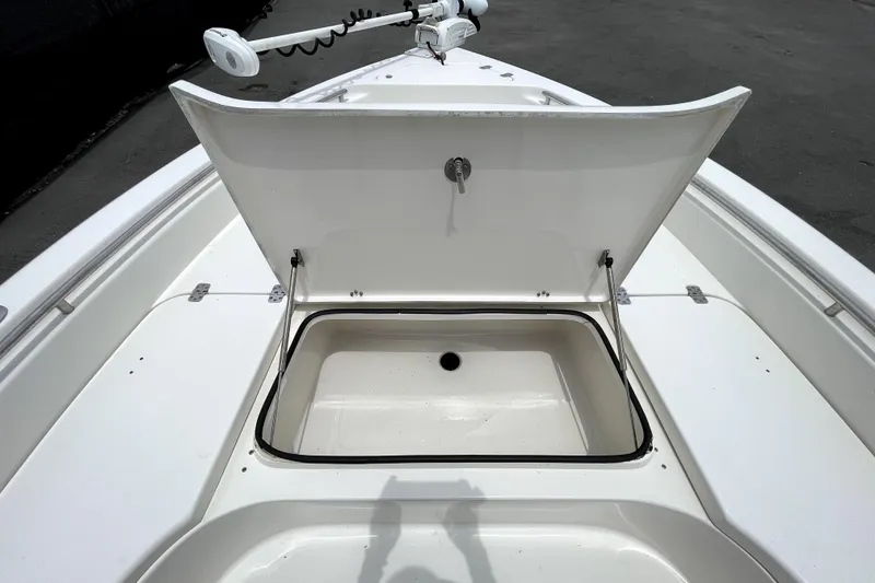 Slide: The Image of Open storage compartment on 2019 ShearWater 25 LTZ boat deck. - 32