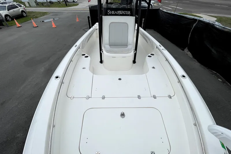 Slide: The Image of 2019 ShearWater 25 LTZ boat with spacious deck and sleek design. - 36