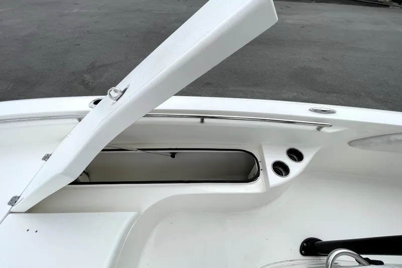 Slide: The Image of Open storage compartment on 2019 ShearWater 25 LTZ boat deck. - 39