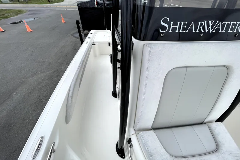 Slide: The Image of 2019 ShearWater 25 LTZ boat interior with seating and branding. - 41