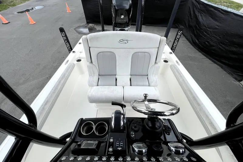 Slide: The Image of 2019 ShearWater 25 LTZ boat interior with steering wheel and seating. - 43