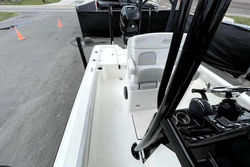 Slide: The Image of 2019 ShearWater 25 LTZ boat interior with seating and control panel. - 45
