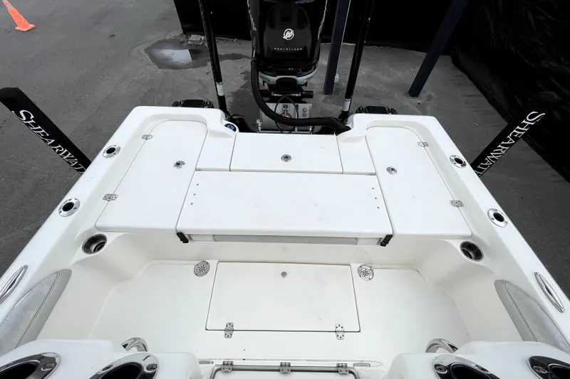 Slide: The Image of 2019 ShearWater 25 LTZ boat deck with storage compartments and seating. - 46