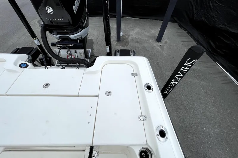 Slide: The Image of 2019 ShearWater 25 LTZ boat deck with Mercury engine and ShearWater branding. - 50