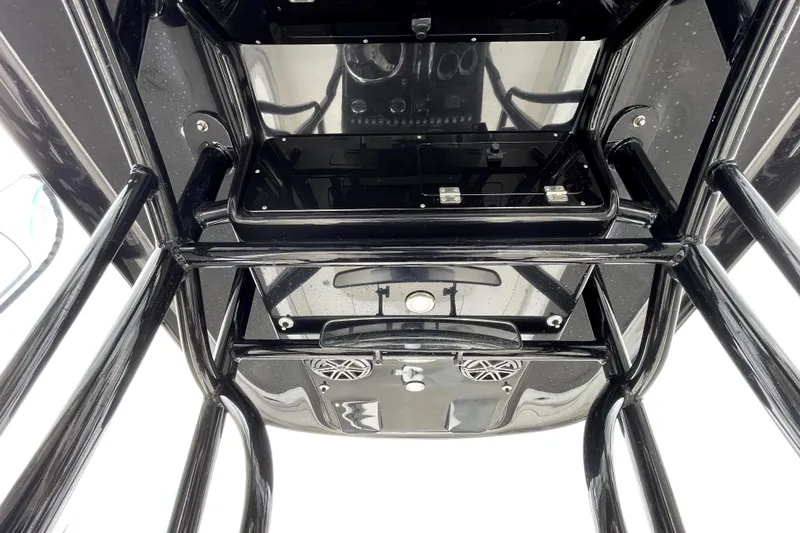 Slide: The Image of 2019 ShearWater 25 LTZ boat console with black framework and speakers. - 55