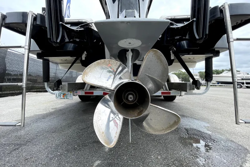 Slide: The Image of Rear view of a 2019 ShearWater 25 LTZ boat showing its propeller and trailer. - 6