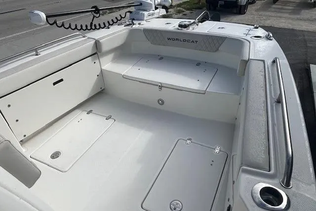 Slide: The Image of 2025 World Cat 235 TE boat interior, featuring spacious deck and storage compartments. - 3