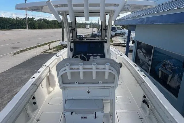 Slide: The Image of 2025 World Cat 235 TE boat interior with center console and seating. - 7