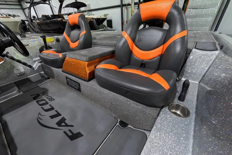 Slide: The Image of 2021 Falcon Boats 195 interior with orange and black seats, showcasing sleek design and comfort. - 12