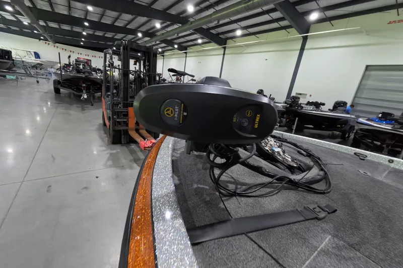 Slide: The Image of 2021 Falcon Boats 195 in warehouse, featuring Minn Kota Ultrex trolling motor. - 15