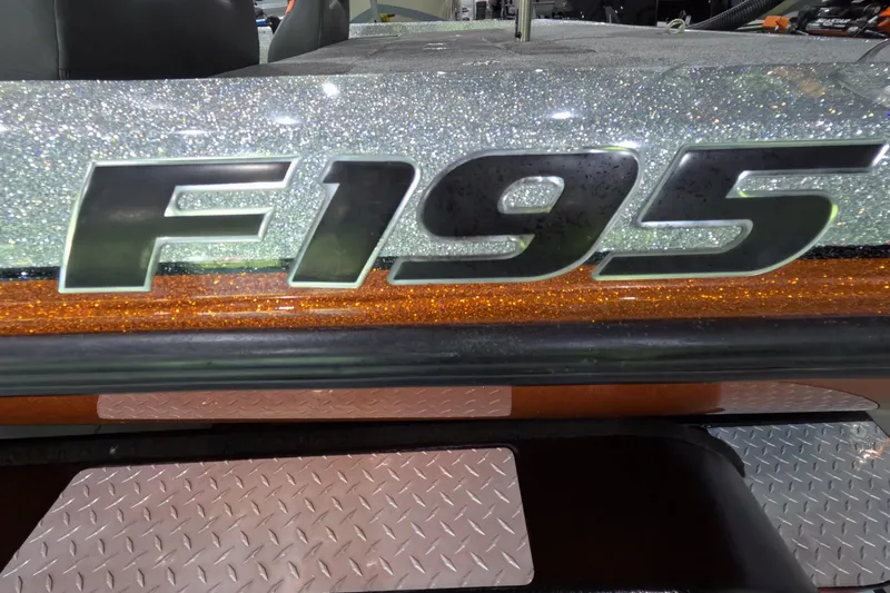 Slide: The Image of 2021 Falcon Boats 195 model with glittery silver and orange detailing. - 17