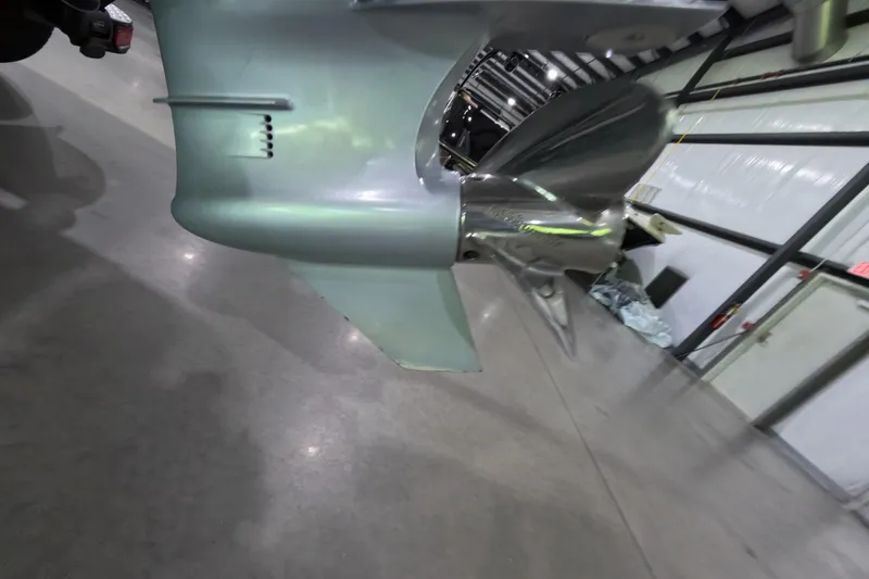 Slide: The Image of Close-up of a 2021 Falcon Boats 195 propeller in a warehouse setting. - 19