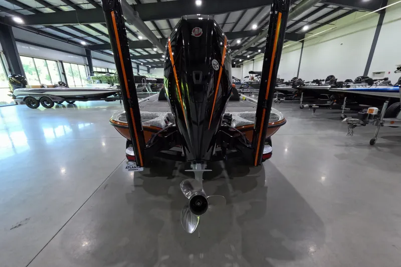 Slide: The Image of 2021 Falcon Boats 195 in showroom, rear view with motor and sleek design. - 3