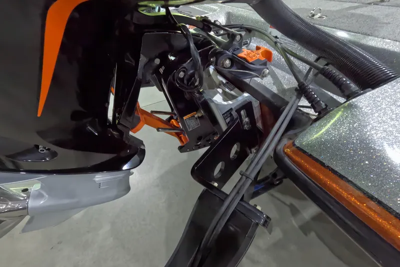 Slide: The Image of 2021 Falcon Boats 195 motor and transom detail with orange accents. - 4
