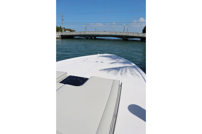 Slide: The Image of Bow of a 2010 CNM 50 yacht approaching a bridge on a sunny day. - 15