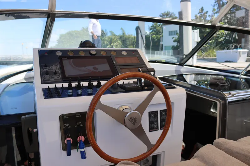 Slide: The Image of Helm of a 2010 CNM 50 yacht with wooden steering wheel and control panel. - 17