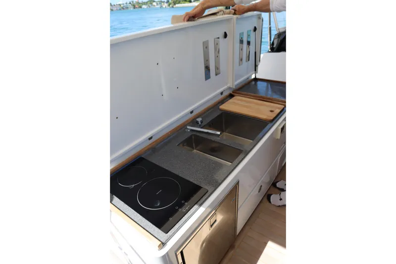 Slide: The Image of Outdoor boat kitchen with stove, sink, and cutting board on a CNM 50 model, 2010. - 18